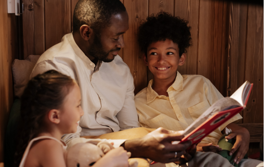 Dad reading to kids