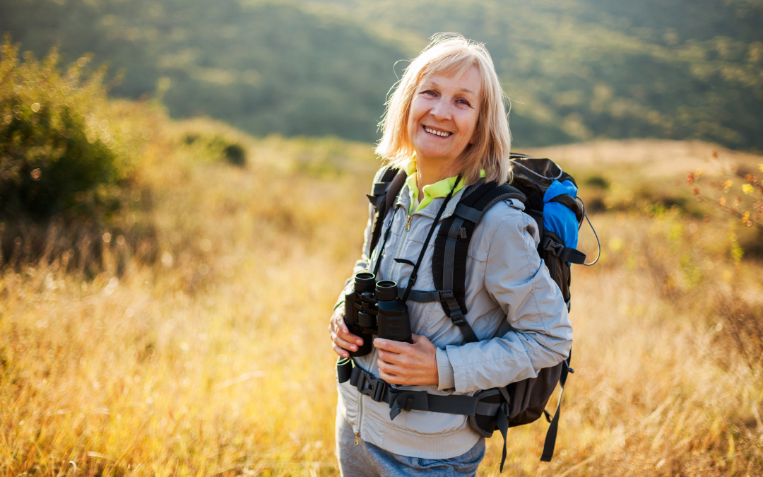 Woman with binoculars on hike
